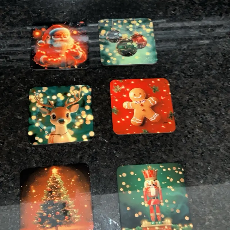 Christmas Themed Coaster Set 6 Piece Featuring Santa Reindeer Gingerbread Man Tree and Nutcracker Designs. Shiny, vibrant design. Customizable, name can be added