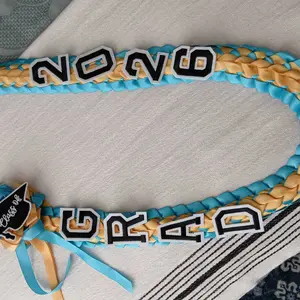 2026 Graduation Leis for Him Her - Hand-Woven Blue Braided Ribbon Lei with GRAD Letters & Cap Charm, Adjustable Graduation Money Lei with Safety Pins for Class of 2026 Graduation Ceremony Party Favors