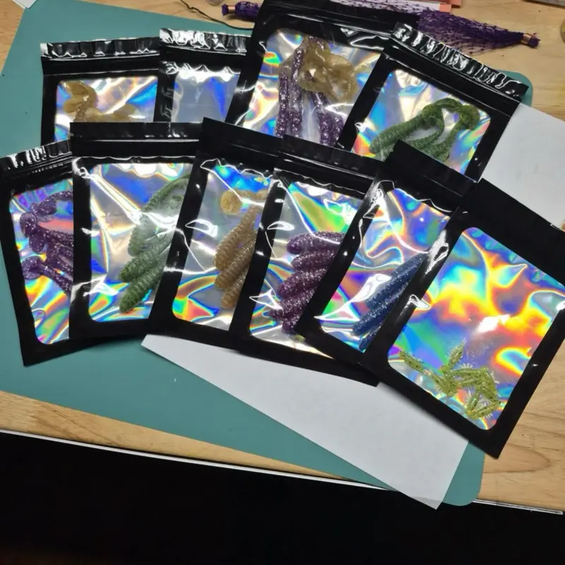 Legendary Soft Baits from America - Product Featuring Holographic Packaging and Various Contents Inside