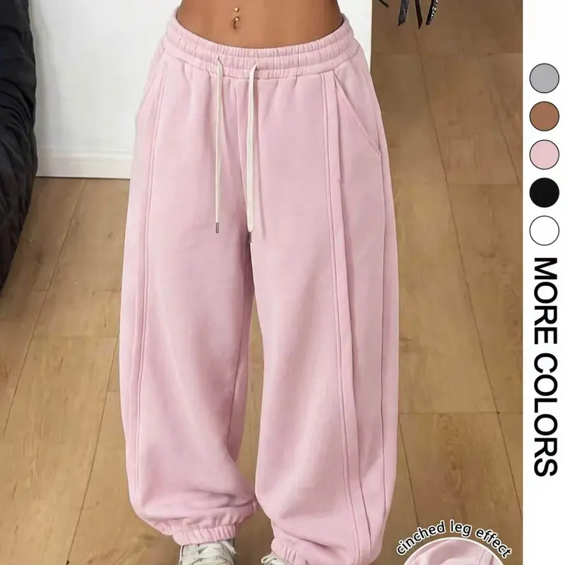 Women’s cotton jogger sweatpants with a drawstring elastic waistband, side pockets, and soft fabric—suitable for autumn and winter outdoor streetwear and everyday wear at home.