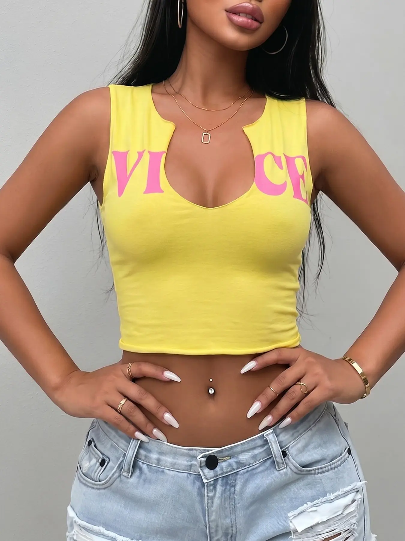 Yellow "VICE" Print Notch Neck Cropped Sleeveless Tank Top, Y2K Retro, Casual & Sultry Vibe, Crop Tank Tops. This form-fitting cropped tank features a bright yellow base, bold pink "VICE" lettering across the chest, and a unique notched V-neckline.