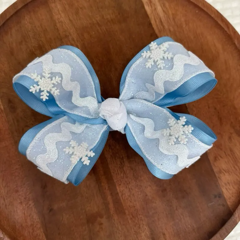 6 Inch Snowflake Light Blue Bow with White Ribbon on Top.