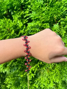 Elegant Red and Black Daisy Bracelet with Gold Accents Adjustable Lobster Claw Clasp and Beaded Patterns Perfect for Any Outfit
