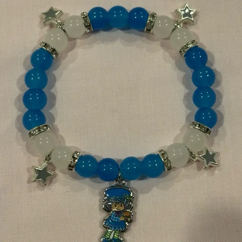 Blueberry Muffin Bracelet with Blue and White Beads and Star Charms Featuring a Blueberry Muffin Charm