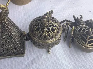 Mia(12949)gc.Artistic metal censers featuring moon pyramid, beast lid and spider shape for your incense collection.
