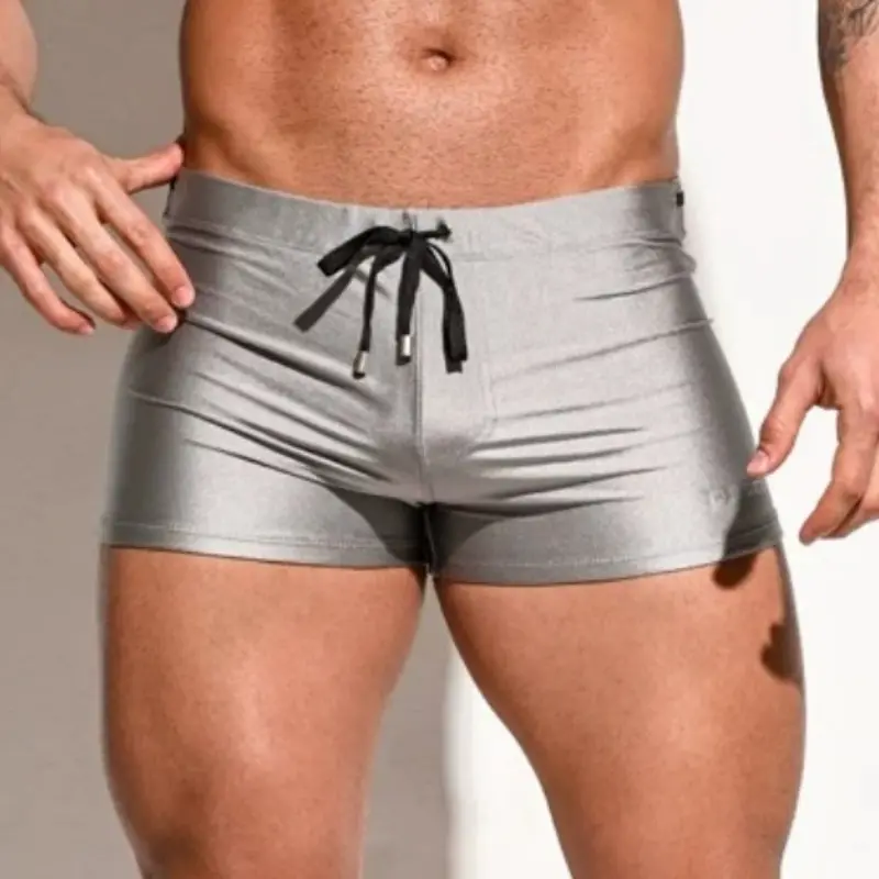 Men's anti-embarrassment flat-angle swimming trunks, summer quick-drying white sexy adult hot spring swimming trunks