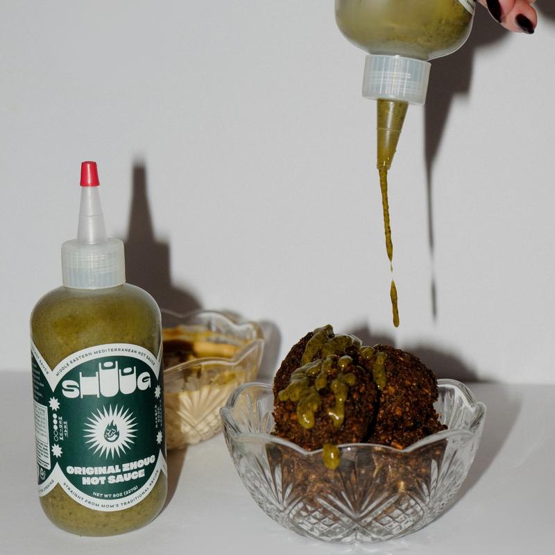 Zhoug Hot Sauce - Shuug is a handcrafted hot sauce that captures the vibrant and bold flavors of the Middle East and Mediterranean regions, all rooted in our decades-old family recipes
