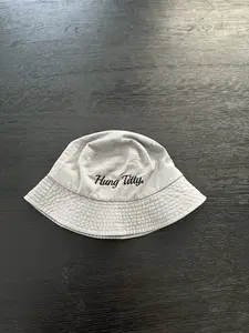 "Hung Titty + 100% Cotton + Casual Wear + Grey Bucket Hat + Adjustable Fit for Men and Women"