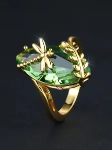 A feminine geometric design ring with synthetic green crystal, stylish and retro gold, perfect for weddings or daily wear as a piece of jewelry.