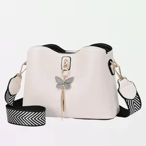 Butterfly Tassel Pendant Shoulder Bag for Women Leather Crossbody Bucket Bag with Adjustable Strap Elegant Versatile Design