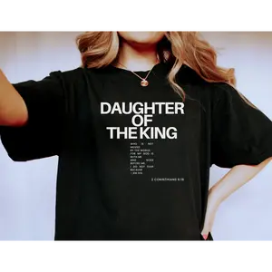 Daughter Of The King T - shirt With Inspiring Biblical Verse From 2 Corinthians 6:18 Reminding The Faithful That They Are Not Moved By The World For God Is With Them And Goes Before Them So There Is No Fear Because They Belong To Him