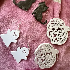 Custom Holiday Ear Rings       * Perfect for Festive Occasions: These custom holiday ear rings are ideal for adding a touch of festivity to your outfit.     * Versatile Design: The ear rings are designed to complement various holiday outfits.