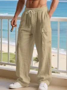 Men's solid-colored linen pants with a wrinkled texture,featuring an elastic waistband.These are simple,lightweight straight-leg pants with a regular fit,offering casual comfort and pockets. Suitable for all seasons,they are classic men's linen long pants