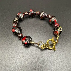 Elegant Red & Black Beaded Bracelet with Gold Toggle Clasp for Stylish Accessory