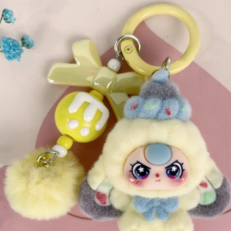 A cute pendant, Cute keychain, Keychain Kawaii, featuring multi-colored plush doll, paired with bow and pom-pom, sweet dreamy style, suitable for hanging on bags or keys, adding girlish lively atmosphere to everyday outings
