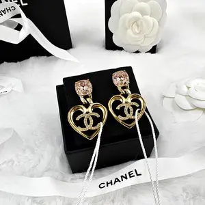 Pre-owned Chanel Gold Brass Heart Logo Swing with Pink Crystal Drop Earrings 1115GIA0055
