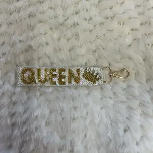 Beaded Keychain with "QUEEN" Design and Metallic Finish, Featuring Sparkling Accents