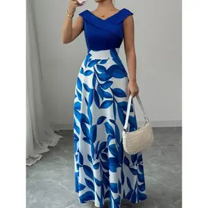 A sleeveless navy blue dress with blue and white leaf print panels and a V-neckline with a flared long skirt, suitable for Womenswear occasions such as dinners, upscale dates, art exhibitions, Evening that require a polished