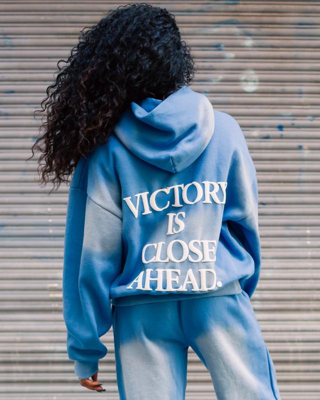 "VICTORY IS CLOSE AHEAD" SUNFADE HOODIE (CLOUD BLUE/ PUFF WHITE)