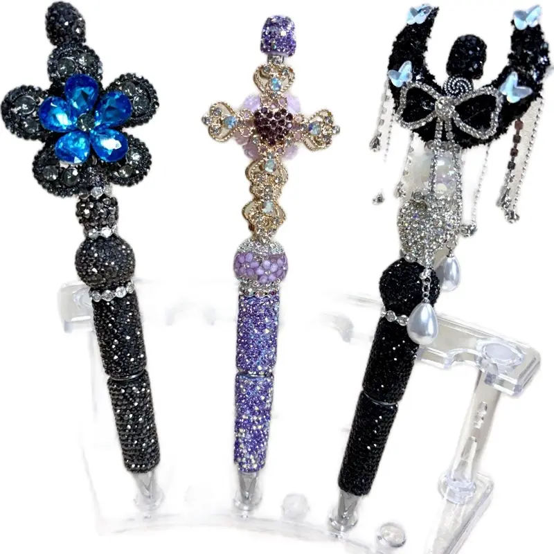 Gray pen w/ gray and blue crystal flower