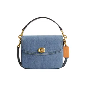 COACH Cassie 19 Denim Crossbody Handbag for Women with Twist Lock Closure, Small Size, Indigo Blue