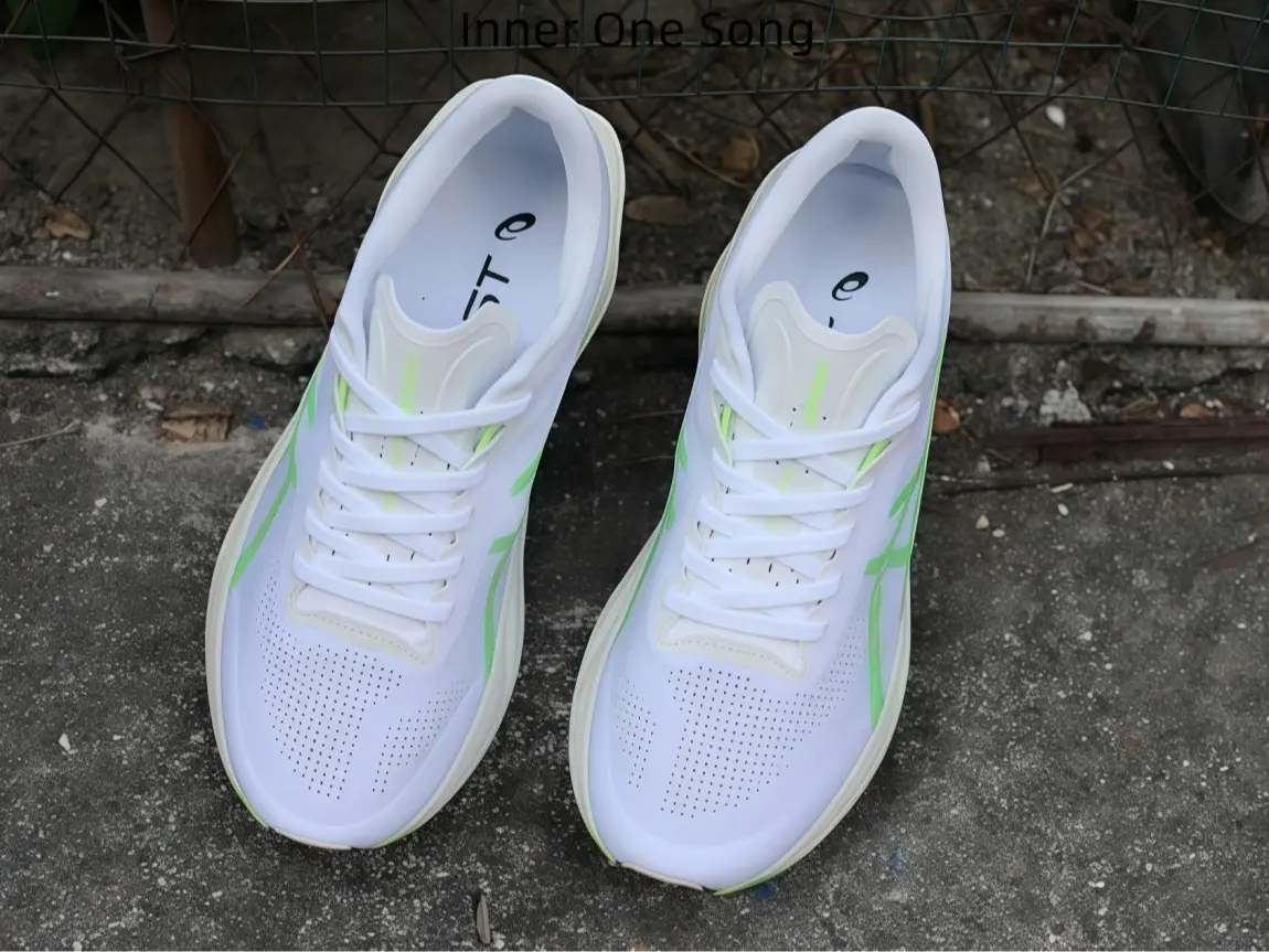 Clean White With Vibrant Lime Green Accent Lace Up Runners, Streamlined Aerodynamic Silhouette, Stable Heel Support Footwear For Amateur Marathon Runners