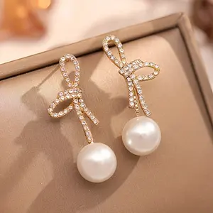 New style Chanel-inspired bowknot pearl tassel earrings, high-end niche design, elegant and unique, versatile earrings, exquisite gift for family and friends