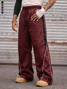 Men’s burgundy wide-leg athletic pants with black contrast trim, Y2K style, drawstring elastic waistband, available in multiple colors, featuring a drapey wide-leg fit suitable for Y2K, basketball, streetwear, commuting, and more.