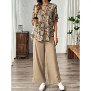 Women’s floral print V-neck long-sleeve top with a faux button at the chest, paired with wide-leg pants; also available as a solid-color two-piece set.
