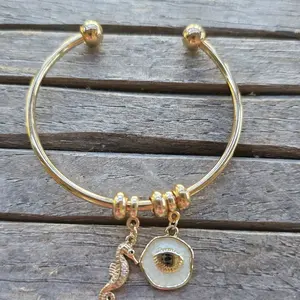 Gold Tone Bangle Bracelet with Shell Charm and Seahorse Pendant for Women's Fashion Jewelry
