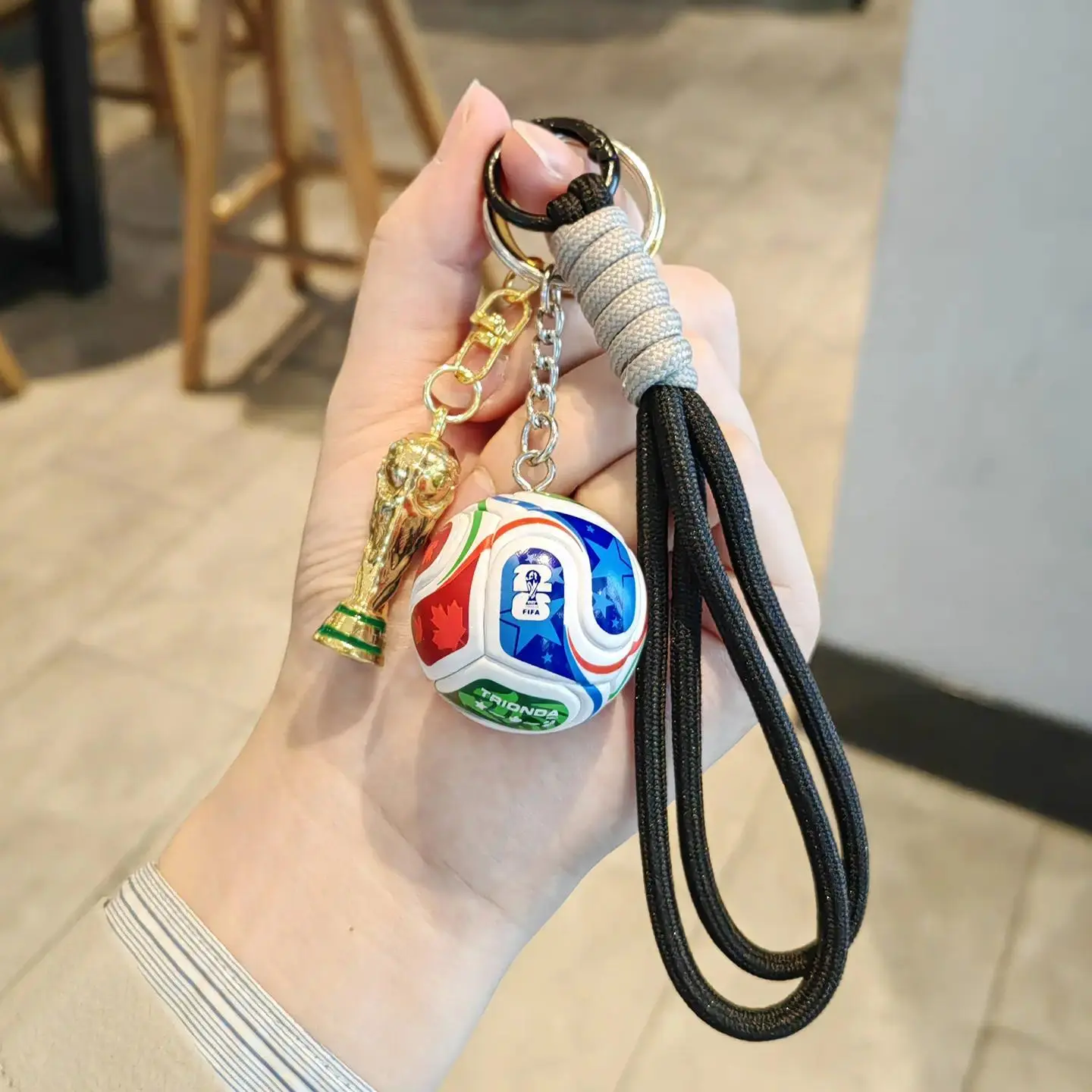 World Cup football + Golden Cup + Black rope