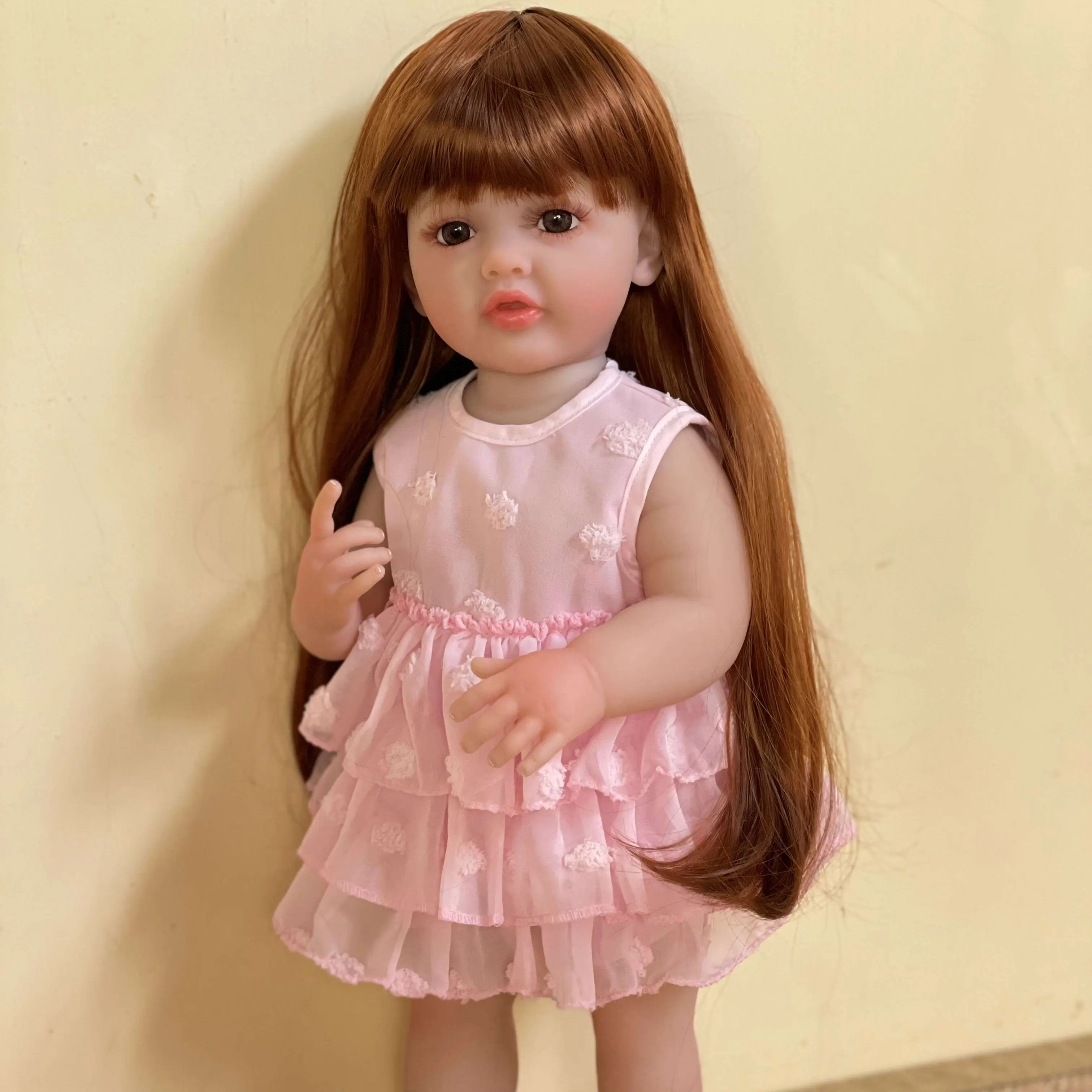 22-inch reborn doll, golden long hair, pink dress – handcrafted, lifelike princess doll, comes with a complete set of accessories including a bottle, birth certificate, and pacifier—perfect gift