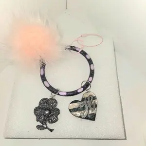 Personalized Initial Keychain Wristlet Phone Holder Black Pink Gun Metal Rose Charm Heart Charm with Silver 3D Initial Powder Pink Faux Rabbit Puff Gun Metal Finish, universal phone holder or key chain, made with your choice of initial, metal bling rose
