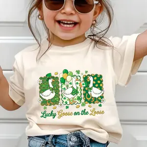YOUTH & ADULT Lucky Goose on the Loose Shirt – St Patrick’s Day Goose Graphic Tee for Youth & Adult, Funny Irish Shamrock Outfit, Holiday Parade & Festive Wear, Youth Clothes, Trending Tees, Family Shirt, Birthday Gift, Perfect Gift for Holiday