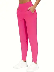 Women's high-waisted sweatpants with solid color, side pockets, and high-elastic cuffs. Suitable for yoga and daily wear. Gym Sportswear Bottoms