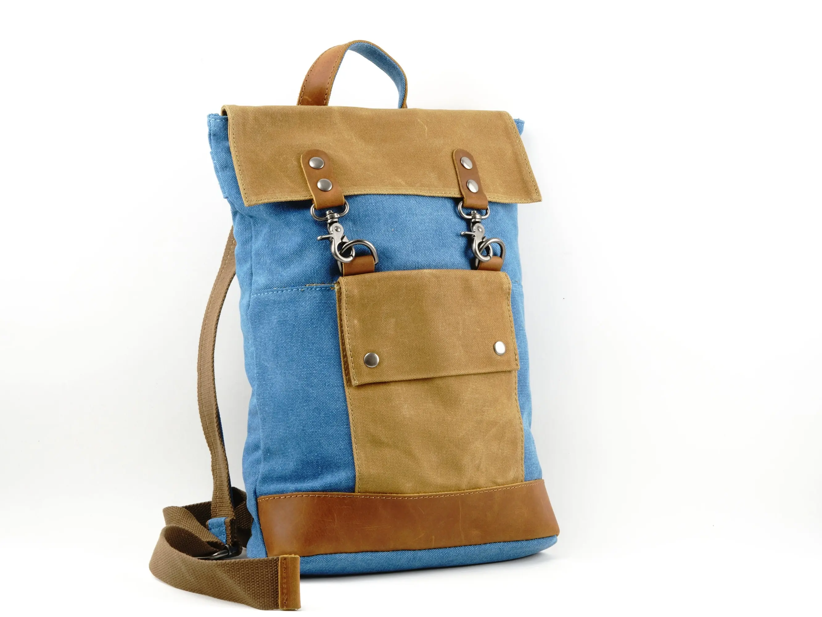 Small Canvas Backpack with Waxed Canvas Panels and Leather Trim. Secure Clip opening with zipper