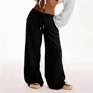 Women’s solid-color pants with pockets—casual, comfortable woven wide-leg trousers suitable for beach vacations and all seasons, featuring loose legs and linen fabric.