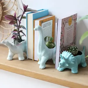 Teal Triceratops Dinosaur Planter to impress your inner child or your science attributeIntroducing the Teal Triceratops Dinosaur Planter - a perfect addition to your décor that is sure to impress your inner child or your love for science.