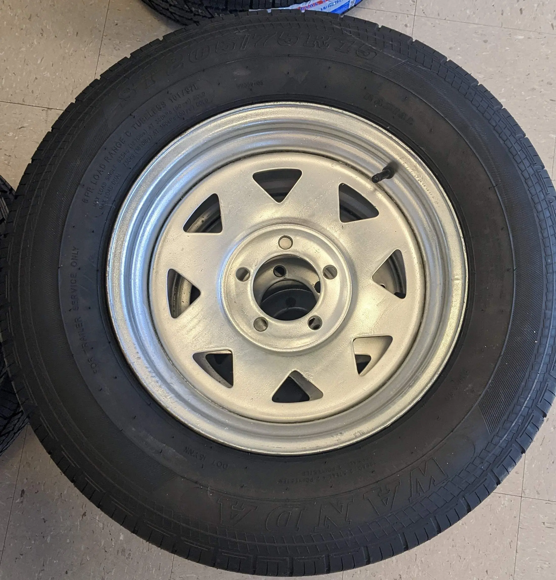ST205/75R15 LRC 5 on 4.5 Silver Modular Tire on Rim
