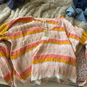 Hem And Thread Sweater