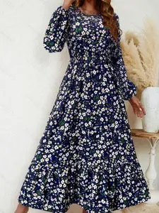 A women's floral round-neck, long-sleeved, fitted Bohemian dress with a waistline and an A-line silhouette, ideal for slimming and versatile for a vacation or date outfit.