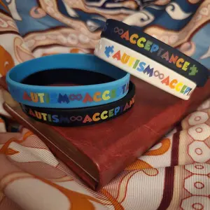 Autism Acceptance Bracelet - Black Silicone Wristband with Colorful Lettering and Puzzle Piece Design