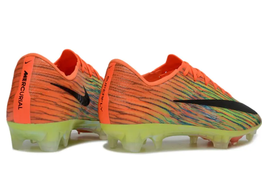Adult Athletic Low‑Profile FG Soccer Cleats, striking orange‑green mixed wavy‑striped woven mesh, contrasting black graphic decorations, translucent luminous lime‑green firm‑ground stud outsole, durable lightweight football shoes