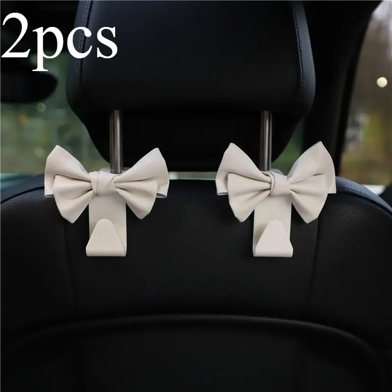2 car mounted hooks, Car Headrest Hook, car hanging accessories, leather bow, car seat back, load-bearing storage hooks, Car Interior Storage, fashionable goddess car accessories, Car Seat Decorative