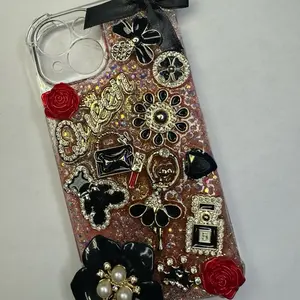 Black and Red iPhone 15 Case with Customized Floral Rhinestone Decorations for Stylish Protection and Elegant Design Classy but Sassy Design