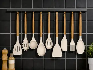 33-piece silicone kitchen utensil set with storage holder. Featuring wooden handles and non-stick silicone material, practical for daily cooking use.