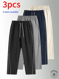 3-pack men’s long pants, men’s casual pants. Wide-leg pants with double white stripes on the sides, featuring an adjustable drawstring design. Loose straight fit that helps conceal curves and create a slimmer look. Available in multiple colors—solid hues