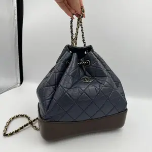Pre-owned AS Backpacks CHANEL Quilted Navy Blue Drawstring Bucket Bag with Chain Strap and Logo Charm