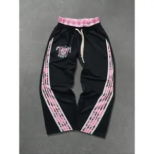 Men’s two-piece sports pants with elastic bottoms, pocket design, moisture-wicking breathable fabric, casual fitted style suitable for all seasons