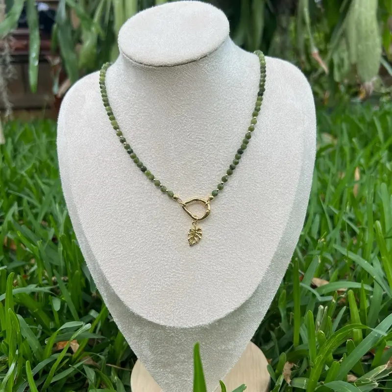 Green jade necklace with gold filled leaf pendant